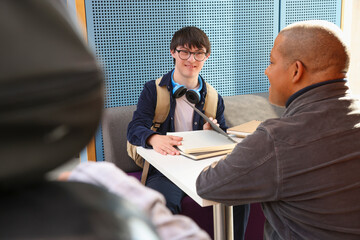Disabled men talking at table