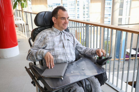 Man in wheelchair in office environment