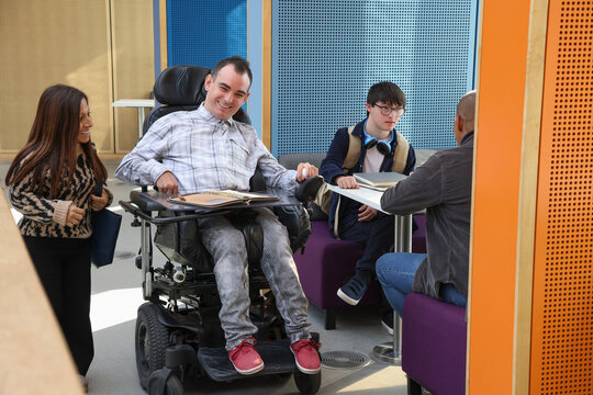 Smiling disabled people in office