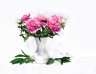 Pink peonies in porcelain vase, green leaves on a light background with space for text