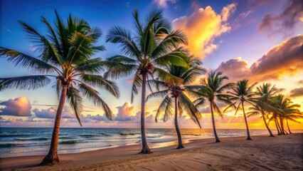 Obraz premium Palm trees swaying in the breeze on a deserted beach at dusk, evening, sand, serene, nature, palm trees