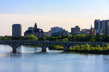A city with a river running through it and a bridge over the water