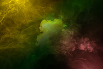 Yellow and pink steam on a black background.