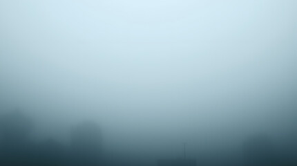 a dense fog obscuring the landscape, creating a sense of mystery and tranquility. The hazy atmosphere evokes a sense of calmness and introspection.