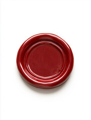 A glossy red circular object with a smooth surface, set against a white background, perfect for design and artistic projects
