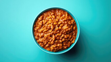 This is a close-up of a bowl filled with chili beans, ready to serve. The color suggests it's hot and spicy, making for a warm meal. Perfect for vegetarians looking for comfort food.