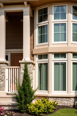 Modern House Exterior with Bay Window and Stone Facade: Luxury Home Design and Architecture