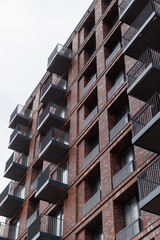 Modern urban architecture with brick facade and balconies