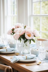 Fototapeta premium Pink peonies bouquet on the spring decorated dining table with baby blue table cloth and napkins - home styled or wedding photography.
