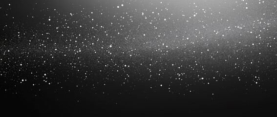 Obraz premium A black and white gradient background with a subtle grainy texture, smoothly transitioning through shades of grey. The fine grain effect adds depth and character, creating a modern and minimalist aest
