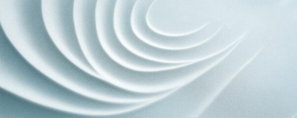 A high-resolution, top-view composition featuring a light gray background adorned with a circular pattern created from fine sand particles. The soft, dreamy aesthetic is enhanced by a subtle gradient 