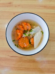 A bowl of carrot soup 