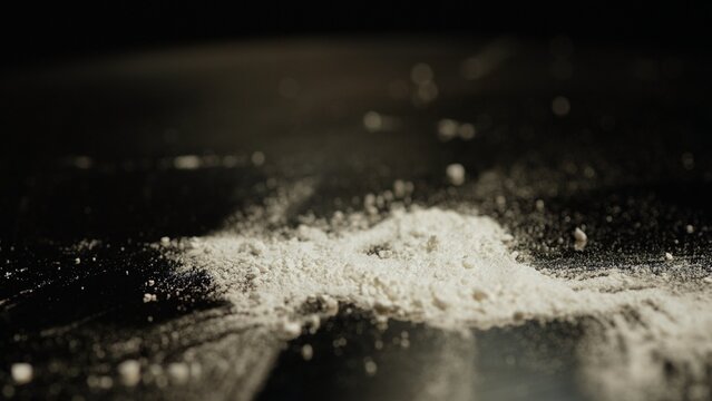 Crushed to powder prescription opioid oxy pills drugs spilled at table for snorting. Opioids cause dependence, addiction and overdose. National Opioid Awareness Day. Potential side affects risks.