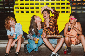 Friends going out in the evening and making party. Young people meeting outdoor in the weekend and...