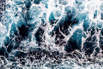 Sea water surface background. Aerial view of beautiful foamy water. Can be used in covers, packaging, posters, textures, banners, art and design projects. Breathtaking nature background image.
