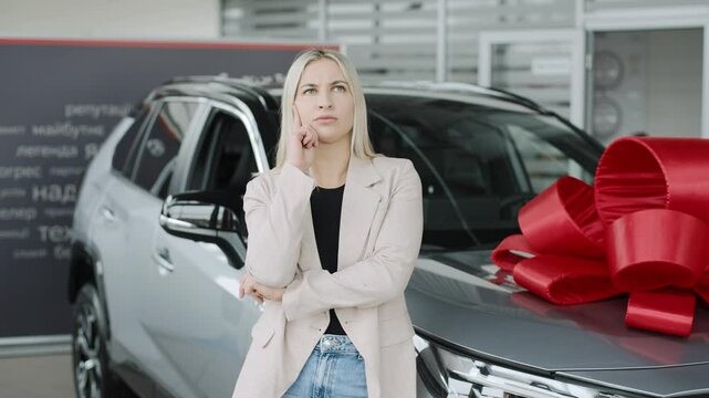Showroom experience with a woman considering her new car purchase in slow motion