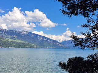 A lake in the Swiss Alps. The Blue Lake in Switzerland. Snow-capped mountains near the lake. Spring.