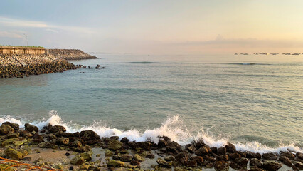 Catching scenic dawn with sunset sky of tropical country, with nice waves and low tides, Dark...