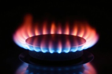 Flames from gas burner mouth isolated on black background, dark background, gas burner