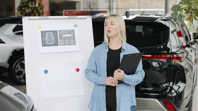 Female sales consultant in a car showroom assisting customers with test drives and purchases in slow motion