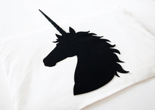 Minimalist Unicorn Head Silhouette: Magical Creature, Horn, White Background - Perfect for T-Shirt Designs, Cards & More - Powered by Adobe