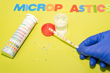 Collection of water samples contaminated with microplastics, contamination by plastic particles and...