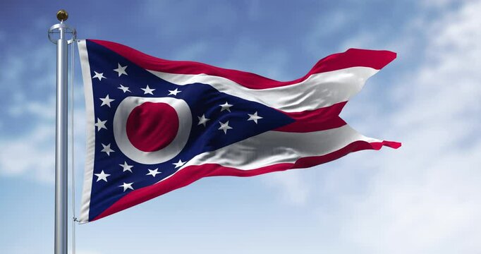 The Ohio state flag waving in the wind on a clear day