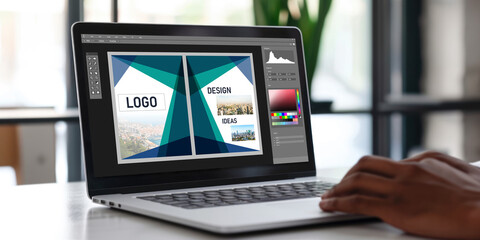 Graphic designer software for modern design of web page and commercial brisk ads showing on the computer screen