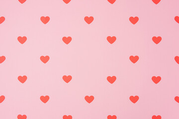 Red hearts pattern, paper cut romantic concept, top view. Beautiful cute hearts on pastel pink background  flat lay composition. Valentines Day greeting card art. .