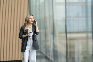 Businesswoman working on a tablet in a contemporary workspace. Capturing ambition, efficiency, and the integration of technology in a sleek, professional environment.