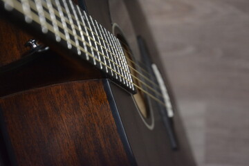 Black guitar zoom in with strings