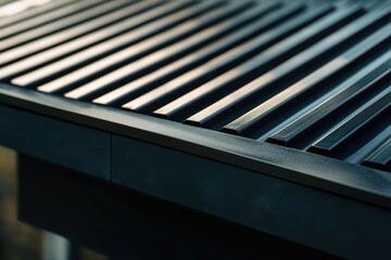 Obraz premium Modern metal roof tiles on house roof showcasing texture and design elements