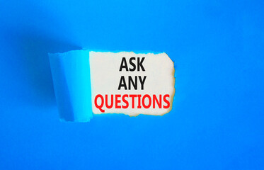 Ask any questions symbol. Concept words Ask any questions on beautiful white paper. Beautiful blue table blue background. Business ask any questions concept. Copy space.