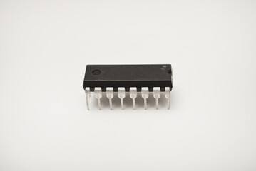A microcircuit on a white background. A computer chip. A component of semiconductor devices.