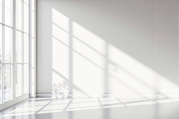 Obraz premium Minimalist space with sunlight streaming through large windows on a white wall and floor.