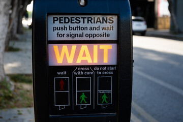 Electronic traffic light to cross a busy street in central Nicosia, Cyprus. Wait sign lights up,...