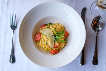 Creamy pasta dish with cherry tomatoes and parmesan