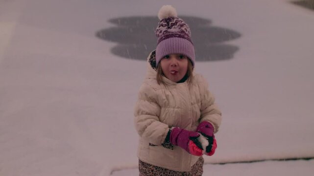 Little Girl Eating Snow