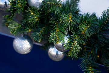 Christmas decorations on the branches of the tree. Christmas mood