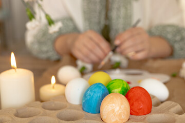 Decorating traditional Easter eggs with care in a springtime setting