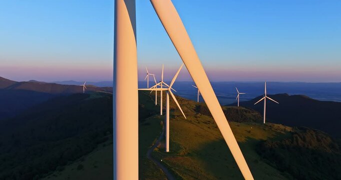 Windy Day In The Mountain Generators Spinning Fast Aerial Steady Shot Sunset