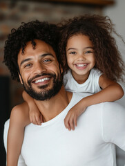 Father and daughter sharing a joyful moment indoors