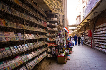 Fototapeta premium Coptic Cairo Alley Lined With Books And Colorful Shelves Inside A Traditional Bookstore In Egypt