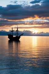 Fototapeta premium Majestic Vintage Ship Silhouette Against Stunning Sunset Reflection