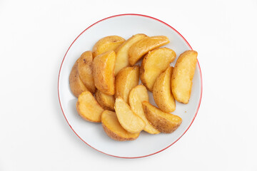 Fried potatoes on a plate isolated on a white background.