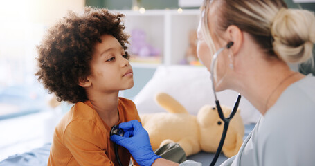 Kid, doctor and stethoscope for healthcare, heart check up and cardiology in clinic. Pediatrician,...