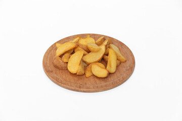 Fried potatoes on a wooden plate isolated on a white background.