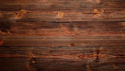 Fototapeta premium A rich, dark wooden texture with prominent grain patterns and knots creates a rustic and natural backdrop. The warm tones and intricate details evoke a sense of durability and craftsmanship