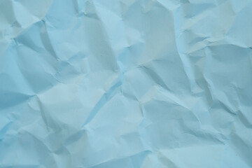 crumpled paper texture. Light blue color. Canvas background