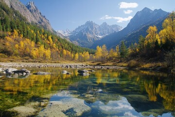 Obraz premium Serene autumn landscape with colorful foliage and mountains reflecting in a tranquil lake under a clear blue sky